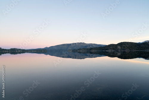 Panorama view of Lake Aluminé and the Andes mountains in the background, at sunset, in Villa Pehuenia, Patagonia Argentina.