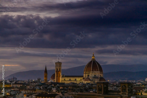 Florence city, Firenze architecture in Italy. Santa Maria del Fiore Cathedral, Duomo huge domes and walls as part of night cityscape from the hill above the city