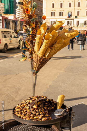 Obraz na płótnie Street trade. Roasted chestnuts on a metal roasting pan w salonie