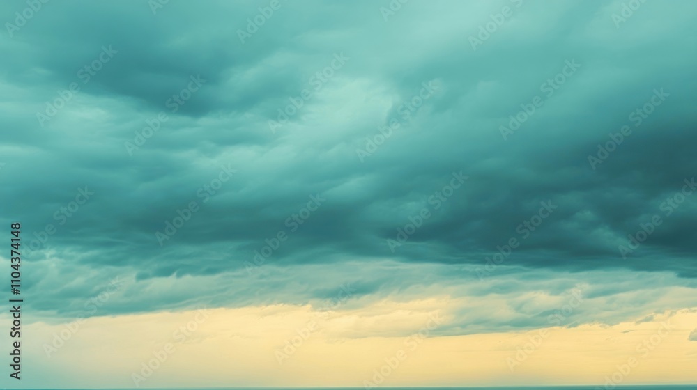 A dramatic sky filled with swirling clouds, transitioning from deep teal to soft yellow hues. A dramatic sky filled with swirling clouds, transitioning from deep teal to soft yellow hues.