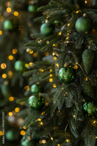 Christmas tree decorated with lights and balls. Bokeh