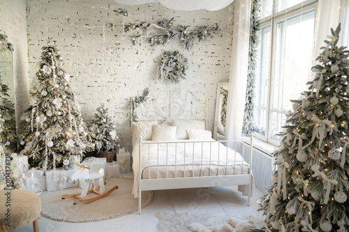 Bedroom interior decorated in a Christmas style. Christmas tree deer swing and bed. photo