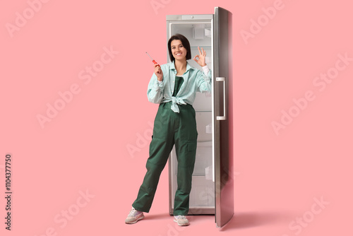 Female worker with screwdri...