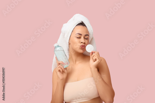 Young woman with towel and ...