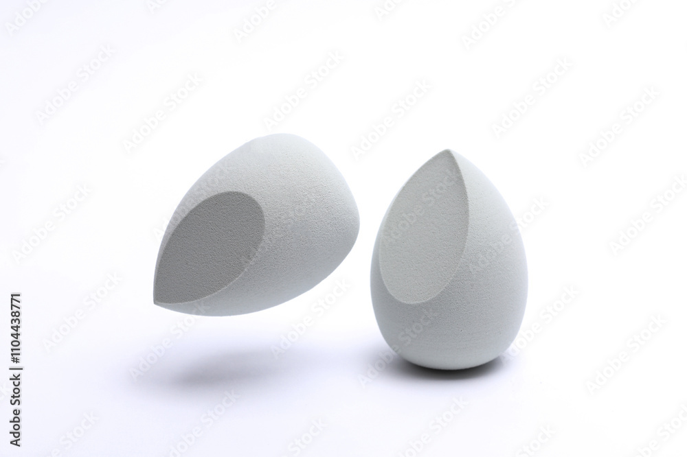 Eggs makeup sponges. Blenders for foundation on white background