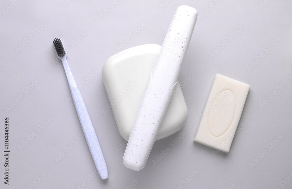 Soap dish and toothbrush storage case on grey background Soap dish and toothbrush storage case on grey background