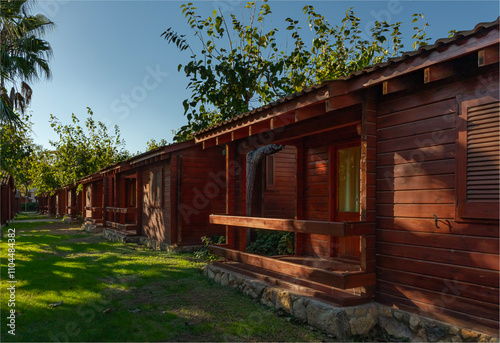 A row of holiday cabins in the Autumn sunshine