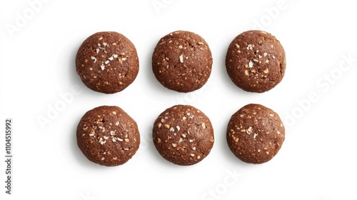 4 homemade brown coconut cocoa biscuits on white