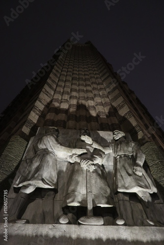 Obraz na płótnie Sculpture group by Lambertus Zijl on the De Bazel building in Amsterdam, the Netherlands, depicting Trade and Industry w salonie