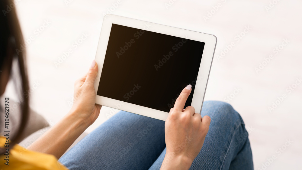 Stay home, chat online. Unrecognizable girl holding tablet computer with empty screen indoors, space for design Stay home, chat online. Unrecognizable girl holding tablet computer with empty screen indoors, space for design