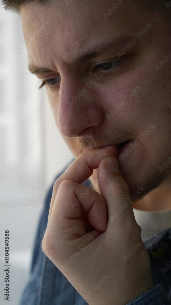 A man in a blue shirt bites his fingernails.
A man bites his nails because he is very nervous.
Signs of excitement and concern in a man.
Severe anxiety in a man A man in a blue shirt bites his fingernails.
A man bites his nails because he is very nervous.
Signs of excitement and concern in a man.
Severe anxiety in a man