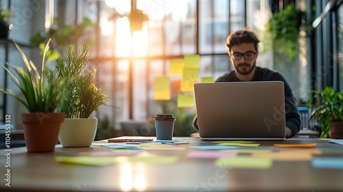 Focused Professional Working on Laptop in Sunlit Office with Plants and Sticky Notes : Generative AI photo