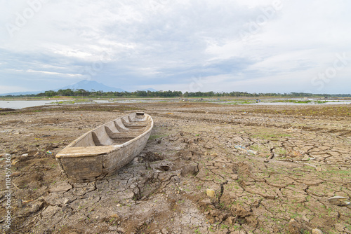 Boat on dry or cracked ground, Climate change and global warming.
