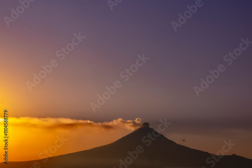volcan Popocatepetl en atardecer desde Cholula Puebla Mexico photo