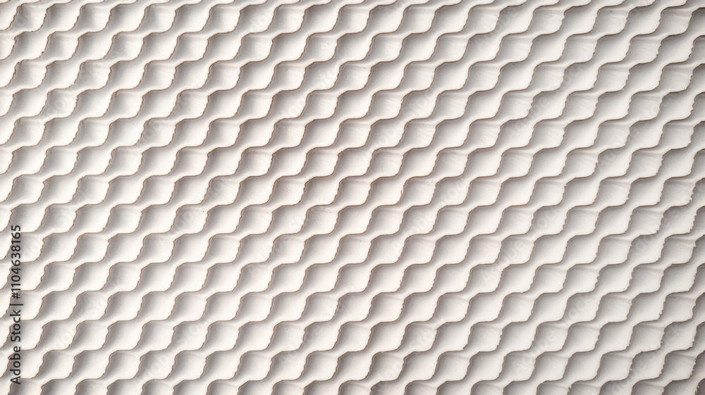 Fototapeta premium Close-up of textured fabric featuring a wavy, repetitive pattern in soft neutral tones, adding depth and visual interest.