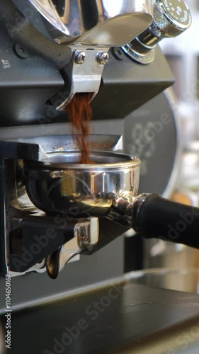 The barista makes coffee, grinds coffee in a coffee grinder, pours espresso, whips milk with a steamer, pours cappuccino and latte with a heart. The coffee machine is making an espresso. Failure