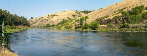 Panorama of the Clearwater River as it flows below the basalt cliffs near Lenore, Idaho, USA photo