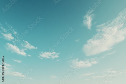clear blue sky with soft clouds