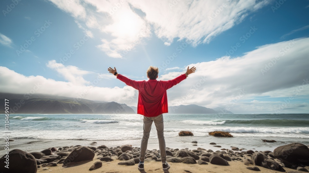 person enjoying the serene beach with arms outstretched under a bright sky person enjoying the serene beach with arms outstretched under a bright sky