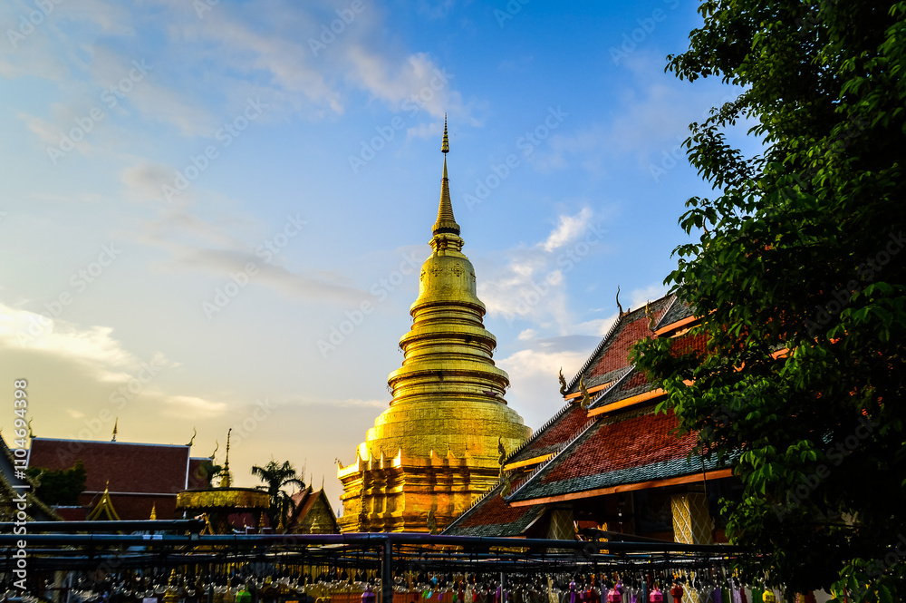 Fototapeta premium Golden Pagoda Lanna Architecture at Wat Phra That Hariphunchai ,Symbols of Buddhism, at Lamphun Northern Thailand,South East Asia