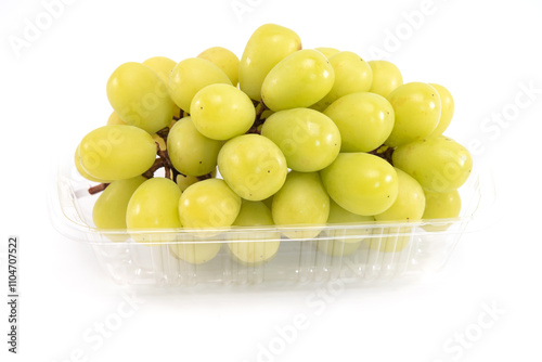 Shine muscat grape in plastic tray isolated on white background. Sweet green grape.