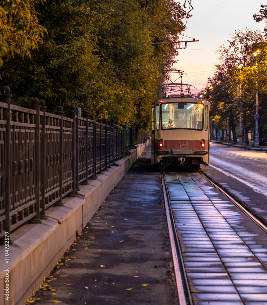 Naklejka premium An old tram on the street in the early morning.