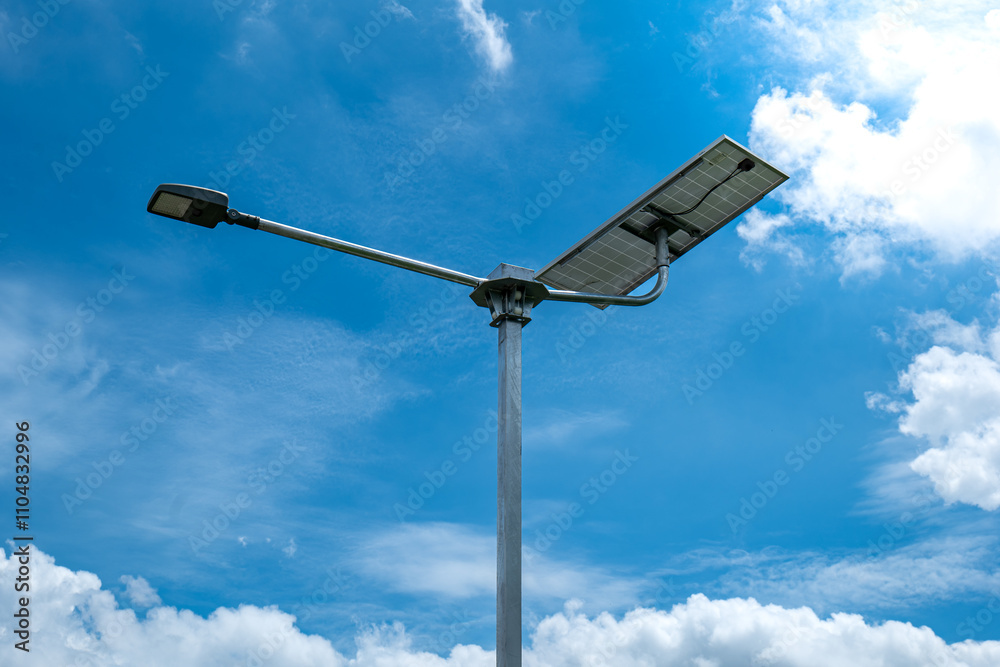 solar powered street light, Solar panels light pole on blue sky background, street light Solar panels pole. solar powered street light, Solar panels light pole on blue sky background, street light Solar panels pole.