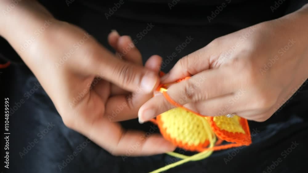 Hand close up crocheting with a hook, wool yarn, creative craft Hand close up crocheting with a hook, wool yarn, creative craft