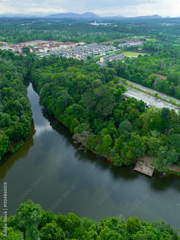 Aerial drone view of Chatin Lake or Tasik Chatin surrounded by greenery trees at Mentakab, Pahang, Malaysia. Aerial drone view of Chatin Lake or Tasik Chatin surrounded by greenery trees at Mentakab, Pahang, Malaysia.