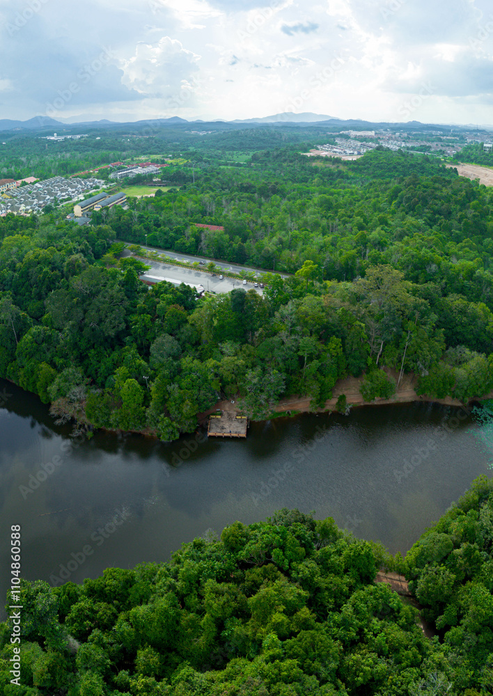 Aerial drone view of Chatin Lake or Tasik Chatin surrounded by greenery trees at Mentakab, Pahang, Malaysia. Aerial drone view of Chatin Lake or Tasik Chatin surrounded by greenery trees at Mentakab, Pahang, Malaysia.