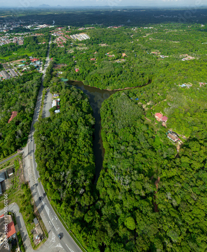 Aerial drone view of Chatin Lake or Tasik Chatin surrounded by greenery trees at Mentakab, Pahang, Malaysia.