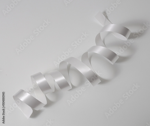 Luxurious white satin ribbon for premium design concepts.