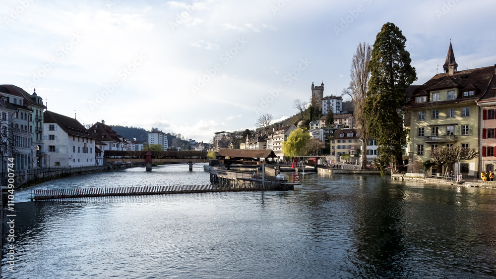 Cityscape of the Old Town (Altstadt) of Lucerne, Switzerland, along the Reuss River on a beautiful sunny spring day. Cityscape of the Old Town (Altstadt) of Lucerne, Switzerland, along the Reuss River on a beautiful sunny spring day.