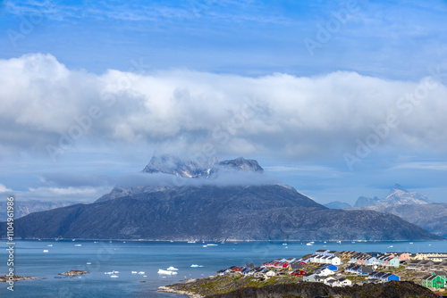 Obraz na płótnie Typical architecture of Greenland capital Nuuk with colored houses located near fjords and icebergs. w salonie