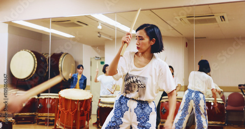 Japanese drums, teacher or people in studio, music and rehearsal for festival. Group, instruments and women in class, stage creativity or hobby with song, Taiko or playing with beat, talent or rhythm