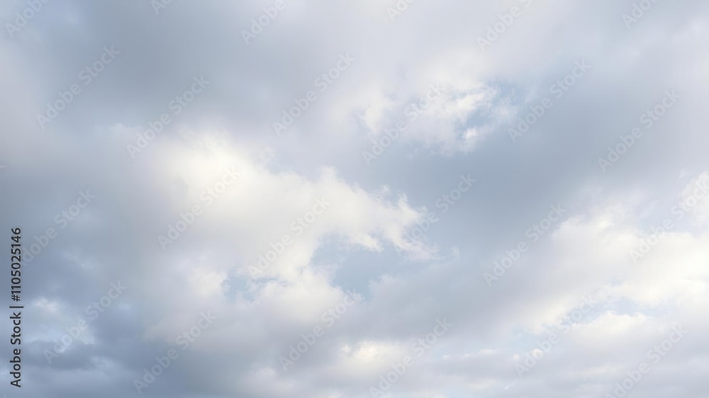Overcast sky with soft white clouds scattered across a blue-gray background, misty landscape, foggy atmosphere, blue grey Overcast sky with soft white clouds scattered across a blue-gray background, misty landscape, foggy atmosphere, blue grey