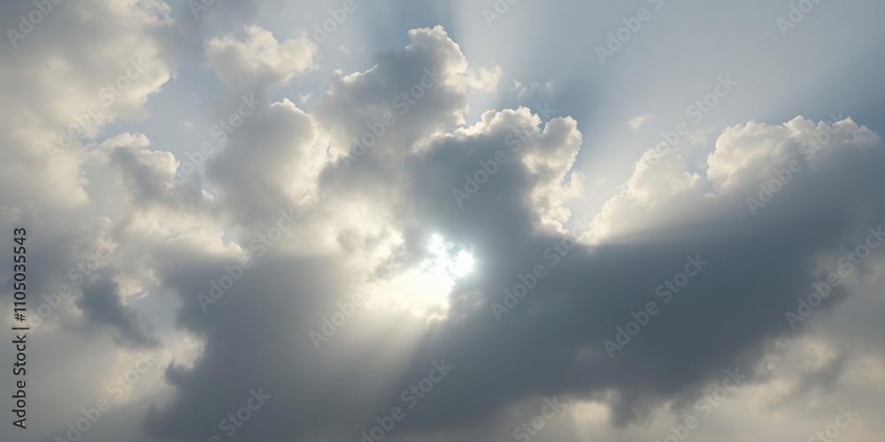 Thick billowy grey clouds obscuring the sun's rays in a diffused light, grey cloud formations, thick clouds Thick billowy grey clouds obscuring the sun's rays in a diffused light, grey cloud formations, thick clouds