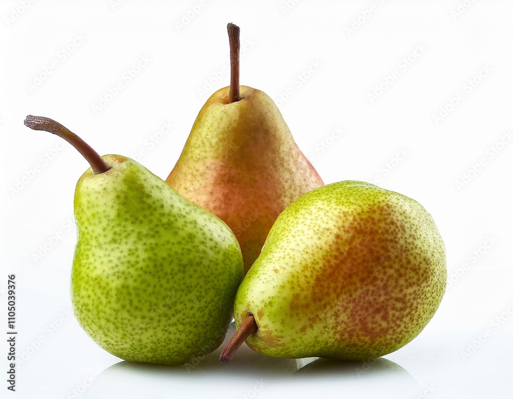 Fresh pears in varying shades of green and red arranged artistically on a white background Fresh pears in varying shades of green and red arranged artistically on a white background