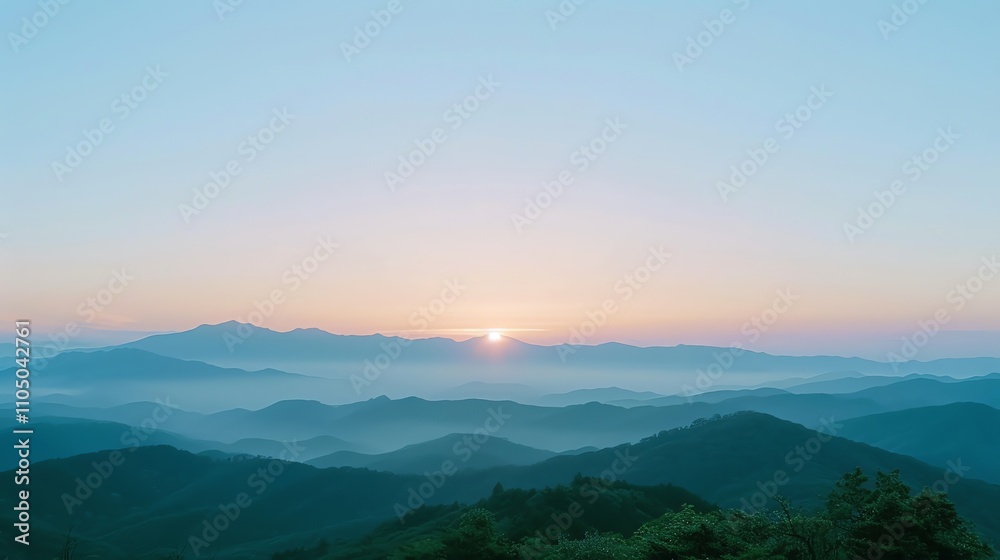 Obraz premium A view of rolling hills and a sunrise in the distance.