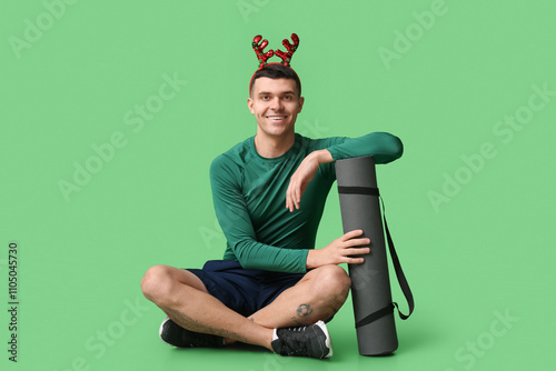 Young happy man in reindeer...