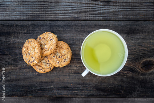 Oatmeal Cookies with Brazilian nuts and tea on wooden table. top view photo