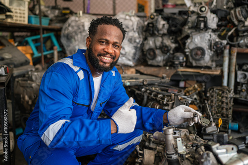 Male Auto mechanic are checking auto engine is problems at car repair shop.