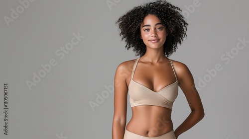 Model posing in a high-waisted two-piece swimsuit against a clean background, space for advertising text, deep depth of field, Product photography with high resolution, studio lighting, advertising