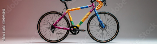 Vibrant multicolored bicycle against gradient background photo