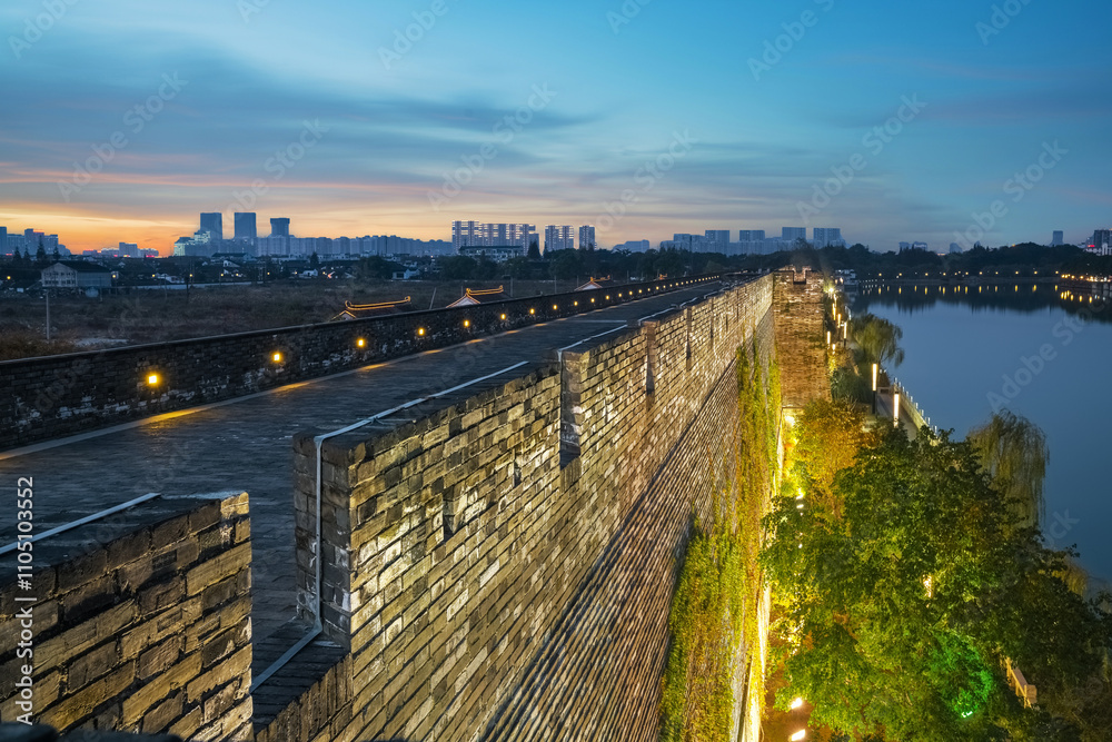 Fototapeta premium The Ruins of the Ancient City Wall and the Night Scene of Suzhou City, Jiangsu Province, China