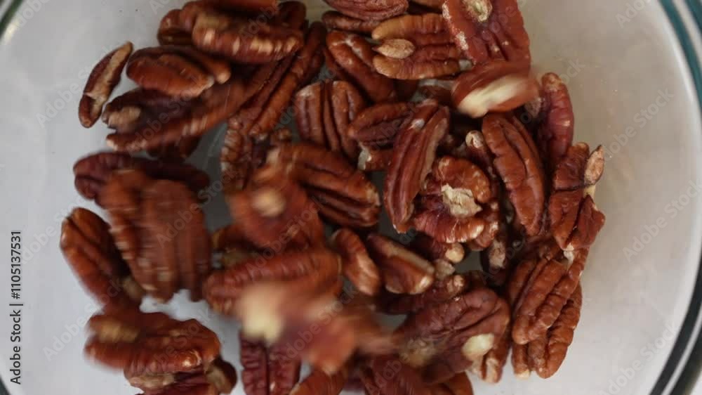 a chief puts nuts in a plate for a cake, close up shot, insert shot, high angle shot a chief puts nuts in a plate for a cake, close up shot, insert shot, high angle shot