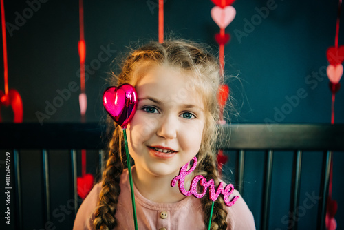 Smiling girl with braided hair holding 
