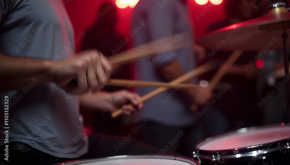 Naklejka premium a close-up of a drummer's hand playing music at a lively party. The focus should be on the hand gripping the drumstick