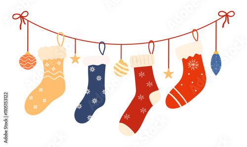 Set of cozy winter Christmas socks, hanging on a garland. Winter shoes with various holiday patterns. Collection of knitted wool and cotton socks with snowflakes isolated on a white background.