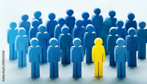 Standing Out: A Yellow Figure Among a Sea of Blue